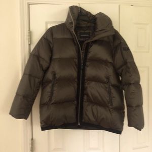 Very cute and trendy brown shiny puffer jacket. Worn only once. Size M